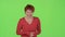 Woman flirts and winks with the men. Green screen