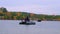 A woman floated on a rubber boat on a large lake in beautiful autumn forest.