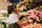 Woman florist picking flower