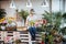 Woman florist sitting and arranging pink tulips in flower shop