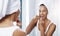 Woman floss teeth in bathroom, mirror and oral hygiene, morning routine with product for dental health. Female person at