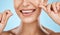 Woman floss teeth zoom, smile and dental healthcare, fresh breath and mouth cleaning isolated on blue background. Face