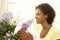 Woman Flower Arranging At Home