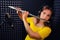 Woman flutist plays Boehm flute, black background. Female flute player playing in music studio. Record wind musical instruments