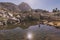 Woman fly fishing at mountain lake