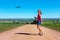 Woman flying a drone in rural landscape