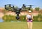 Woman Flying High-Tech Camera Drone (Large File)