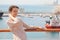 Woman in focus. ships in Qaboos Port out of focus