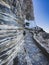 Woman following a stairs to visiting Orthodox monastry of Panagia Hozoviotissa on amorgos island, Greece, Cyclades