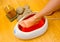 Woman foot in paraffin bath at the spa