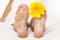 Woman foot with yellow flower