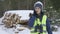 Woman forester using smartphone in winter forest