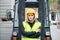 Woman forklift truck driver in an industrial area.