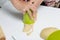 A woman forms dumplings with a glass. Extrudes the required shape in the dough. Cooking dumplings with blueberries and cherries