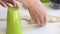 A woman forms dumplings with a glass. Extrudes the required shape in the dough. Cooking dumplings. Close-up shot