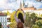 Woman forms a shape of a heart with her hands in front of the famous Castle of Prague, Czech Republic