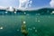 Woman freediver glides with fins over ocean with air bubbles