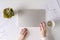 Woman freelancer finishing working and closes laptop with empty drink up cup of coffee and the end of working day. graphics