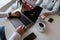 Woman freelancer sits at a table working with a manager in a modern office. Colleagues are working on a business project. Teamwork