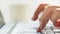 Woman freelancer working on laptop at home-office. Close up of female hands. Businesswoman writing business letter at