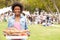 Woman With Fresh Bread Bought At Outdoor Farmers Market