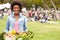 Woman With Fresh Produce Bought At Outdoor Farmers Market