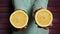 Woman with fresh yellow cutted lemon fruit