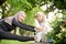 woman friend athlete stretching her leg outdoor together