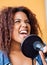 Woman With Frizzy Hair Singing While Looking Away