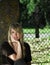 Woman in front of church fence