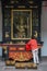 Woman in front of holy sculpture