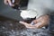 Woman frosting a cupcake baking