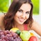 Woman with fruits. Healthy eating, beauty and dieting concept