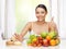 Woman with fruits rejecting junk food