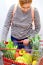 Woman fruits supermarket fitness 50 plus vegetables measure basket shopping trolly red item purchase street market