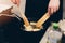 Woman frying breaded fish in hot oil