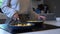 Woman frying potatoes in a pan at home