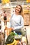 Woman with full trolley at the supermarket.