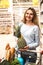 Woman with full trolley at the supermarket.