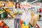 Woman funs with cabbage swings in a supermarket