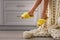 Woman in fuzzy slippers at home, closeup. Weekend morning