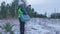 Woman fWoman forest scientist take pictures of young spruce stands