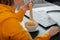 Woman gamer eats noodles with chopsticks Chinese dish in workspace interior using on the table with desktop pc computer during