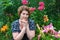 Woman in garden surrounded by flowers