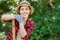 Woman gardener holding shovel