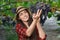 Woman gardener picking grape