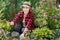 Woman gardener pulling out the weeds