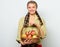 Woman gardener rustic style hold basket with apples harvest on light background. Lady farmer proud of her harvest. Apple