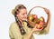 Woman gardener rustic style hold basket with apples on white background. Cook recipe concept. Woman villager carry