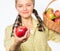 Woman gardener rustic style offer you apple on white background selective focus. Try this ripe juicy apple. Woman